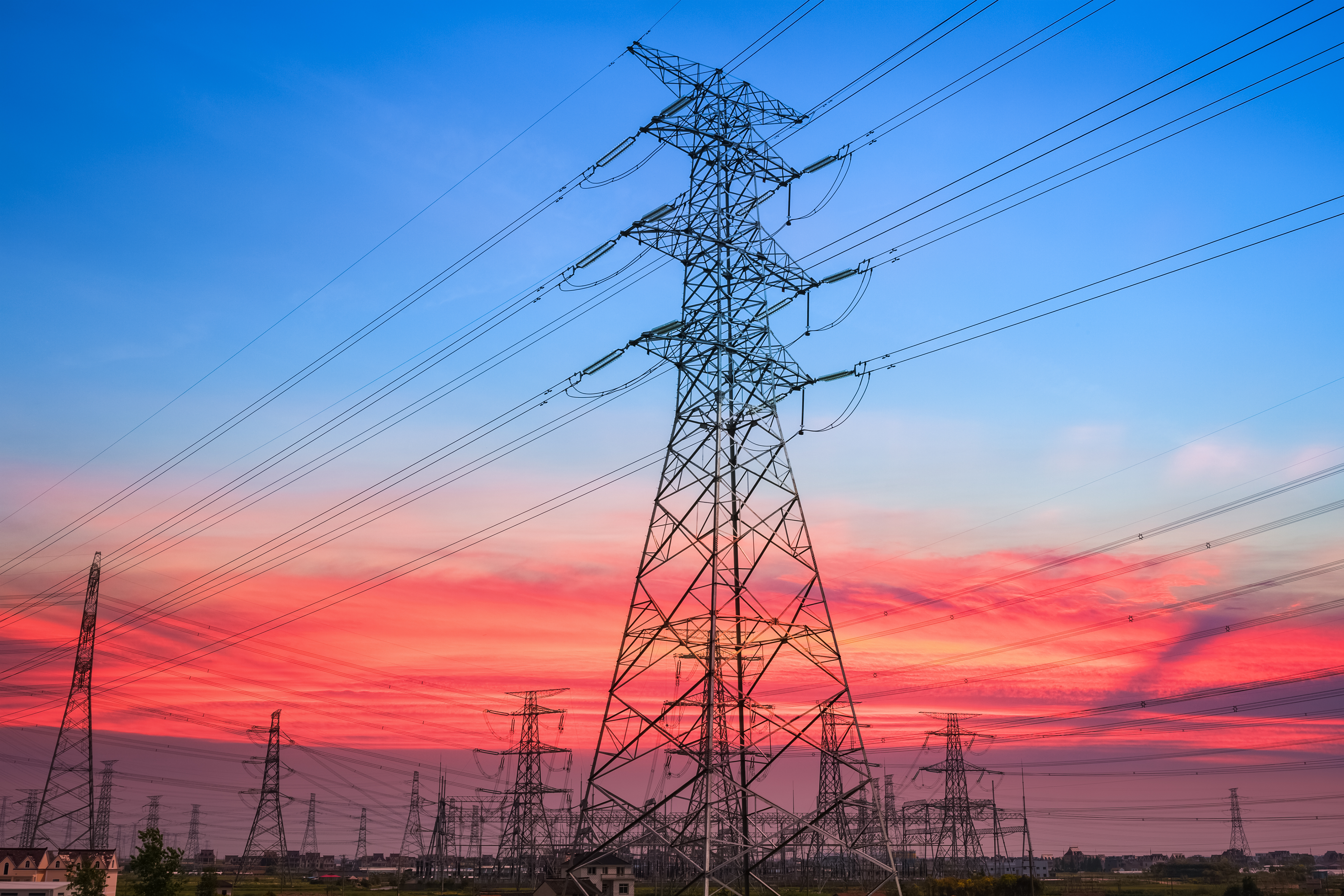 https://watt.co.uk/wp-content/uploads/2020/04/electricity-pylon-in-sunset-PFED56H.jpg