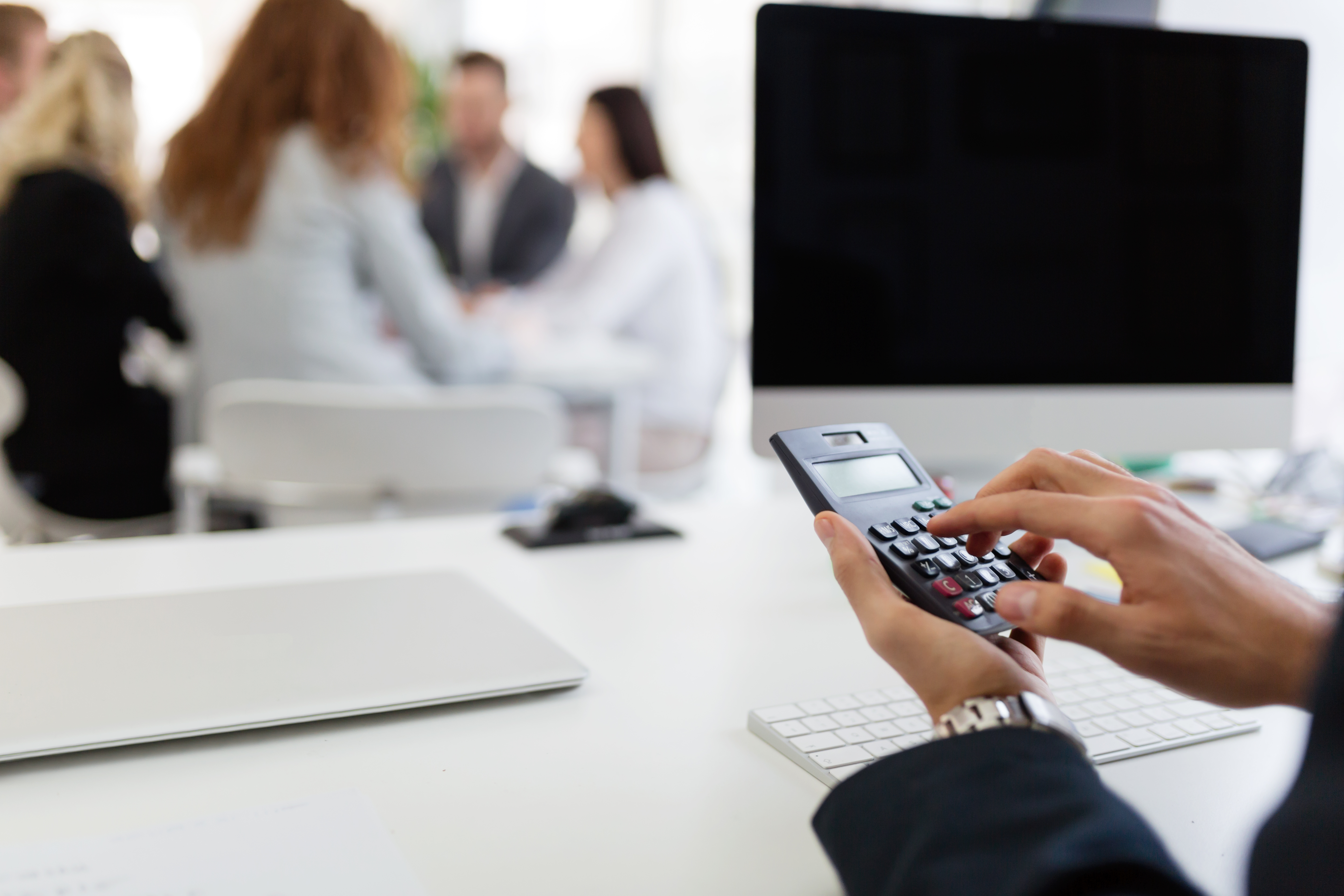 https://watt.co.uk/wp-content/uploads/2020/04/picture-of-busy-man-using-calculator-in-office-2AFSYBW.jpg